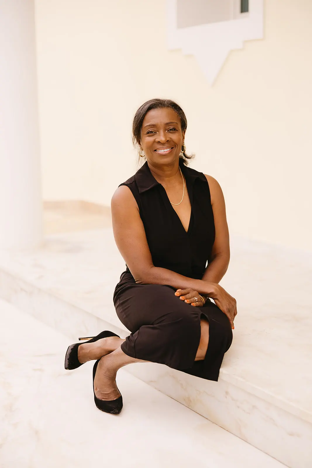 jennifer seated on a marble step